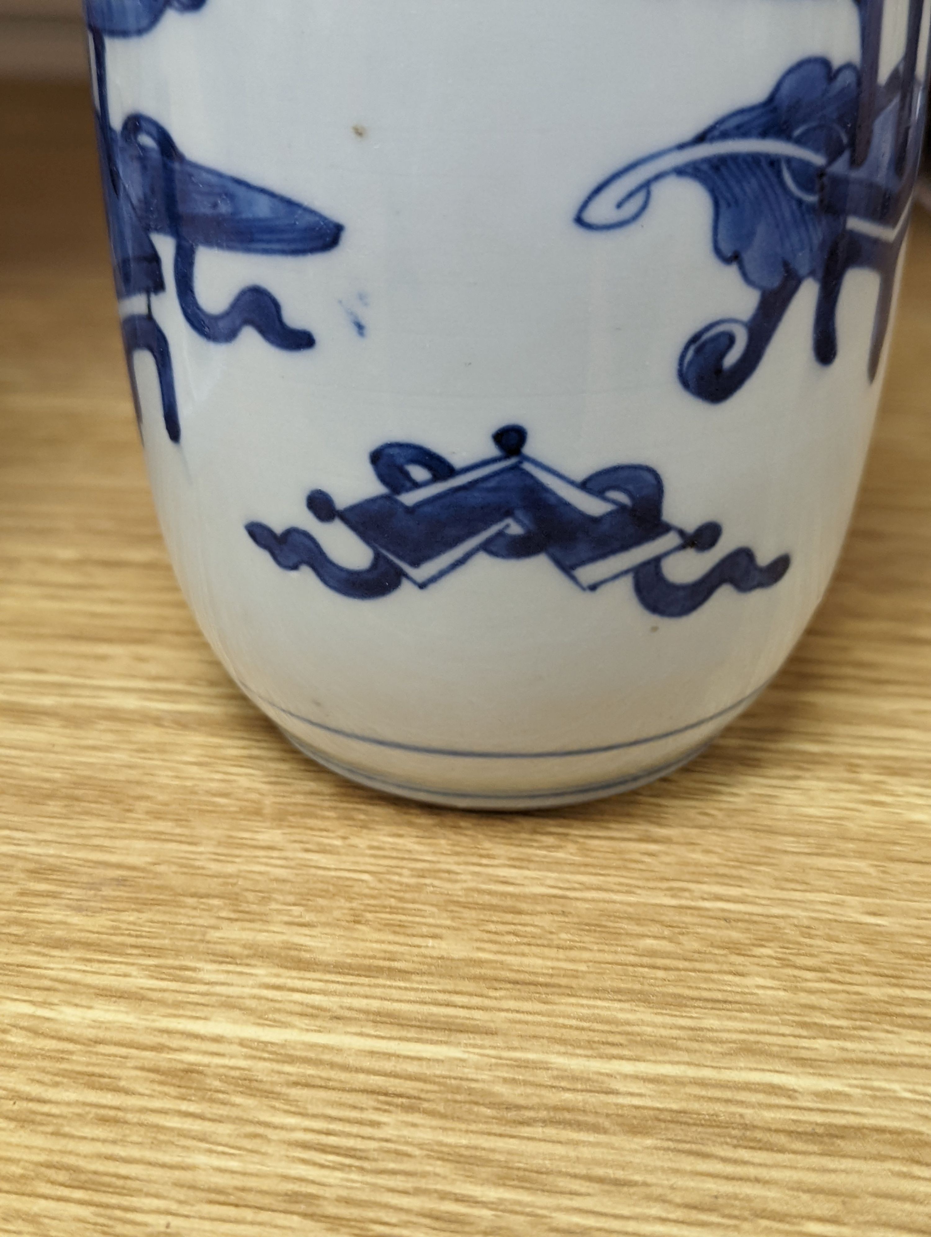 A Chinese blue and white ‘Antiques’ vase, 19.5 cms high.